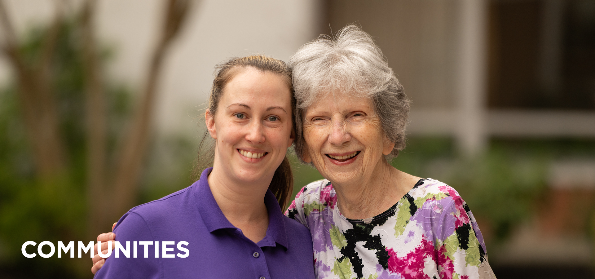 UMC communities header copy A uniformed Pitman Manor teammate smiles and shares a hug with one of her favorite residents.