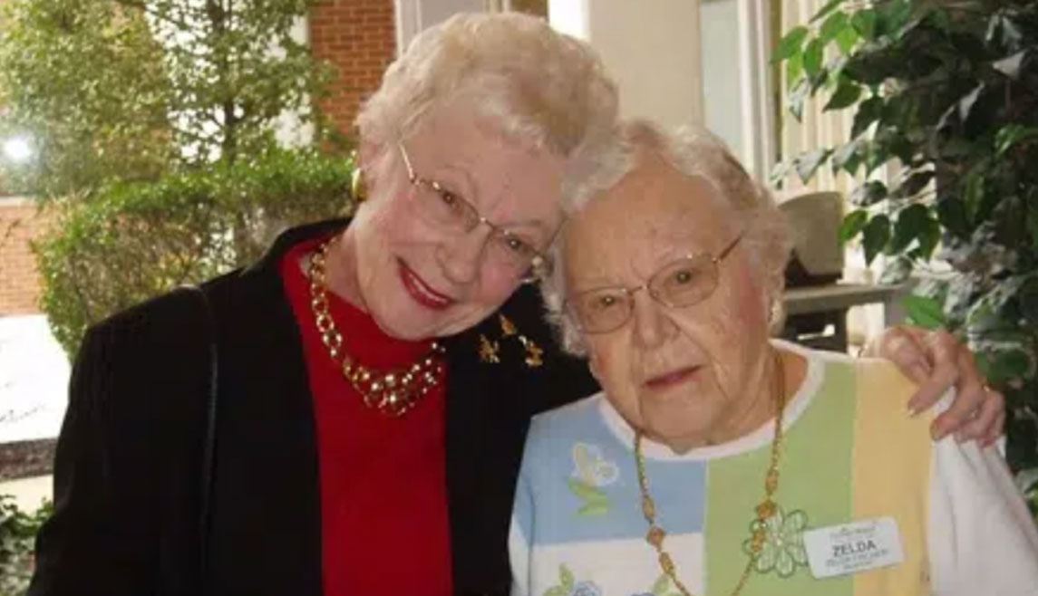 A centenarian resident poses with her daughter inside Pitman Manor.