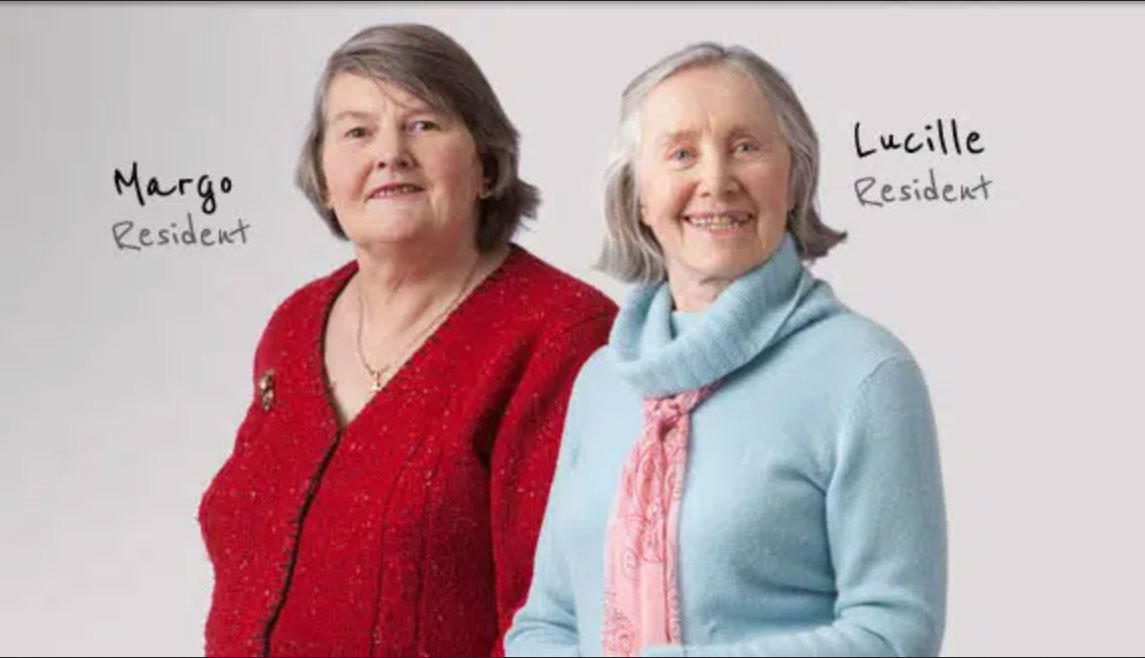 Two older women pose for a photo shoot at their UMC senior living community.